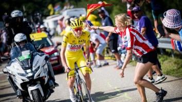 Tour De France Spectator Nearly Run Over By Car After Getting Kicked Into The Street By Vigilante