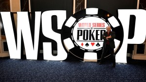 actor Jason Alexanders standing in front of World Series of Poker sign