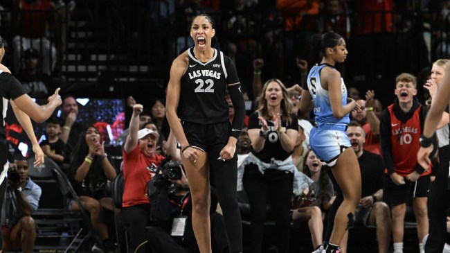 A'ja Wilson celebrates after a play while Angel Reese stands in the background.