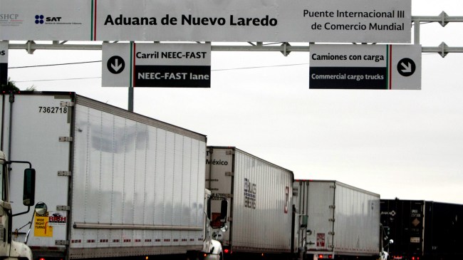 Commercial cargo trucks cross World Trade International Bridge in Nuevo Laredo