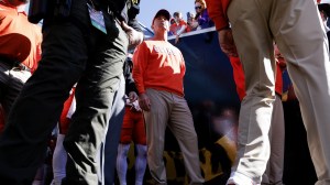 Dabo Swinney walks onto the field for a game between Clemson and Kentucky.