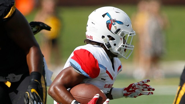 A Delaware State football player runs the ball vs. Missouri.