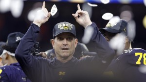 Michigan coach Jim Harbaugh celebrates a national championship win