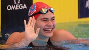 Luana Alonso of Paraguay reacts after winning the Womens 100 Meter Butterfly