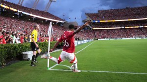 A Manchester United player with a corner kick vs. Liverpool at Williams-Brice Stadium.