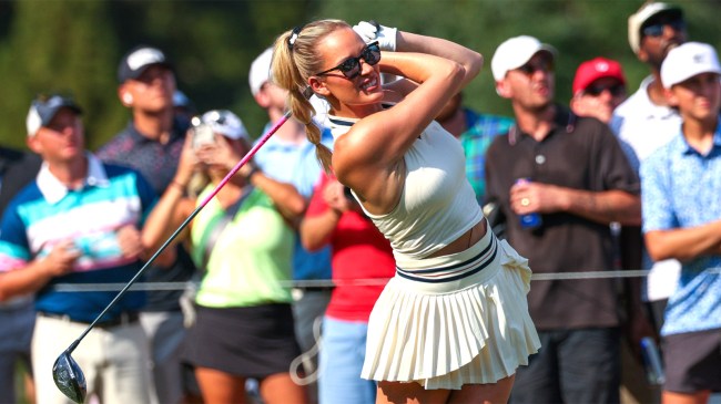 Paige Spiranac hits a tee shot on the 13th hole during the 2024 Creator Classic