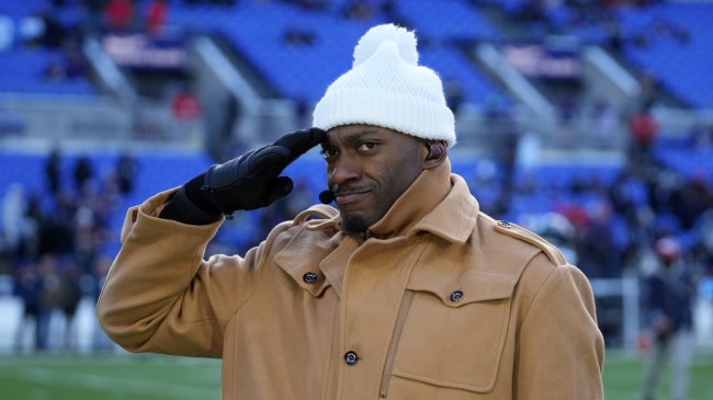 Robert Griffin III salutes while on set of an NFL Playoff game.