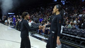 Sydney Colson and A'ja Wilson warm up before a Las Vegas Aces game.