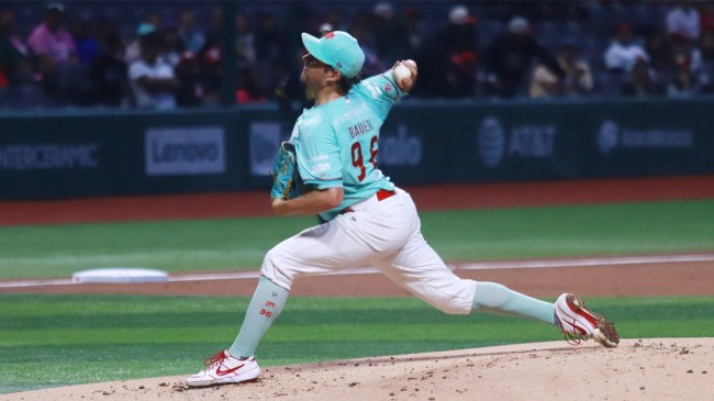 Trevor Bauer of Diablos Rojos pitches against Leones de Yucatan in the Mexican Baseball League