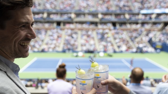 Tennis fans toast drinks at the US Open.