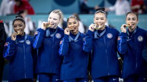 USA Gymnastics Womens National Team bite gold medals