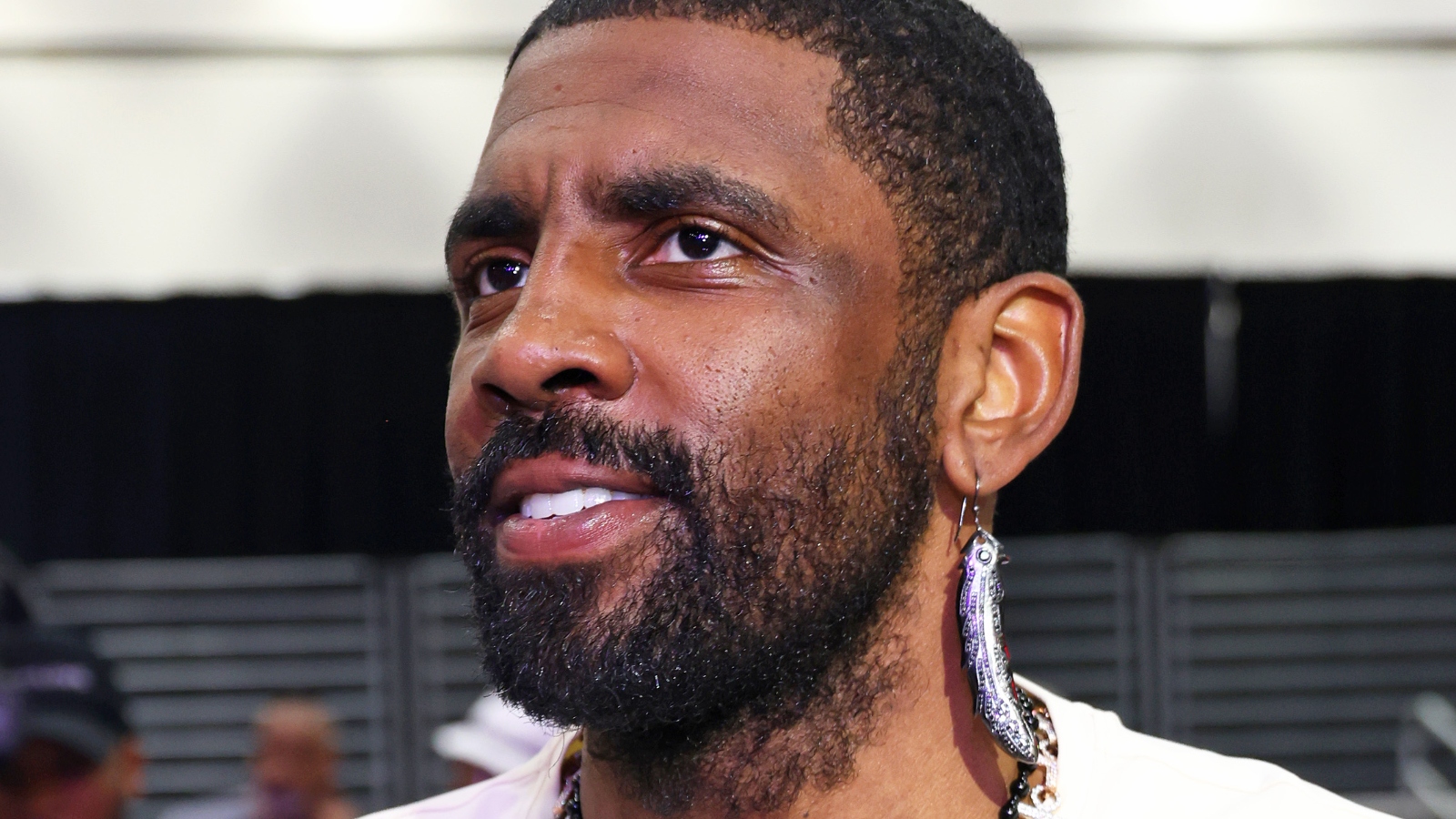 Kyrie Irving showing off his earring 