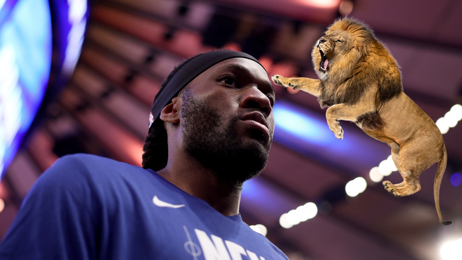 Precious Achiuwa and a lion