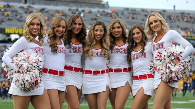 Texas Tech cheerleaders pose for a photo during a football game against West Virginia.