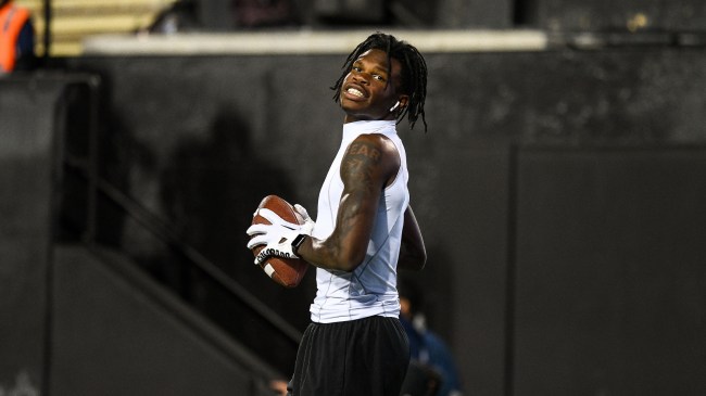 Travis Hunter warms up before a football game in Colorado.