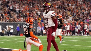 Washington WR Terry McLaurin celebrates after making a catch over Cincinnati DB Cam Taylor-Britt.