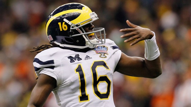 Denard Robinson 16 of the Michigan Wolverines celebrates touchdown pass