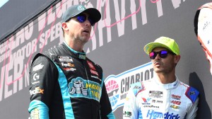 Denny Hamlin and Kyle Larson talk prior to NASCAR Cup Series Quaker State 400