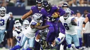 Derrick Henry 22 of the Baltimore Ravens rushes for a first down against the Dallas Cowboys