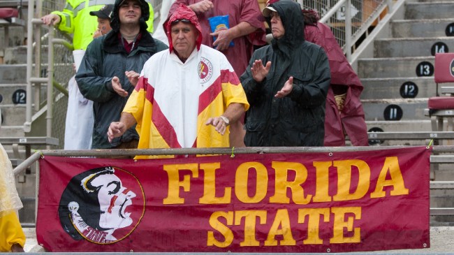 FSU fans watch a football game in the rain.