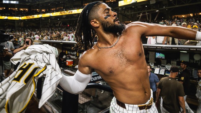 Fernando Tatis Jr 23 of the San Diego Padress throws his jersey into the crowd