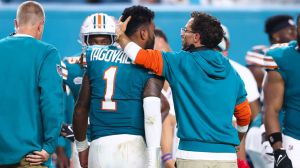 Head coach Mike McDaniel of the Miami Dolphins embraces Tua Tagovailoa