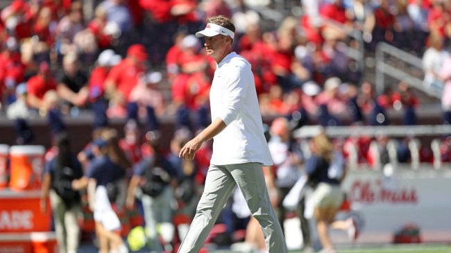 Ole Miss football coach Lane Kiffin on the field before a game.