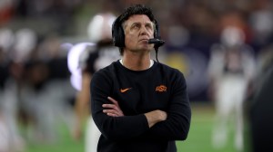 Oklahoma State head coach Mike Gundy watches on from the sidelines.