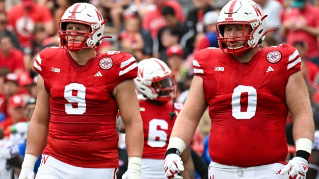 Nebraska Cornhusker defensive linemen on the field during a game.