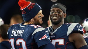 Tom Brady and Chandler Jones celebrate on the sidelines