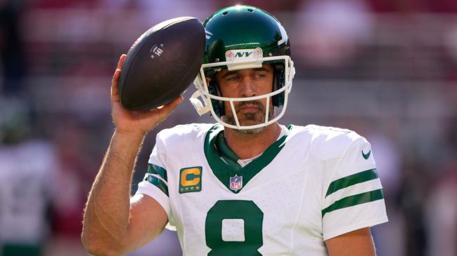 aaron rodgers holding a football