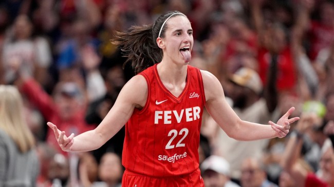 Indiana Fever guard Caitlin Clark celebrates after making a shot.