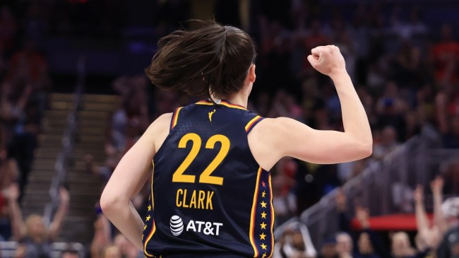 Indiana Fever guard Caitlin Clark celebrates on the court.