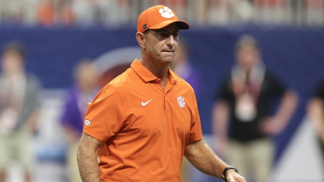 Clemson head coach Dabo Swinney walks onto the field.