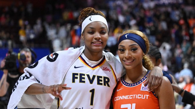 NaLyssa Smith and DiJonai Carrington pose for a photo after a game between the Fever and Sun.