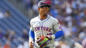 New York Mets infielder Francisco Lindor honors first responders during a game.