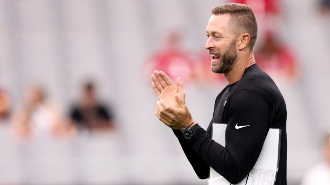 Kliff Kingsbury on the field before a game between the Commanders and Cardinals.