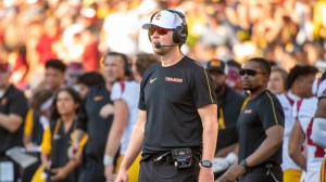 USC football coach Lincoln Riley on the field during a game vs. Michigan.