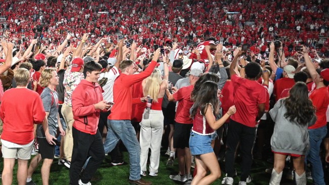 Nebraska fans storm the field after a win over Colorado.