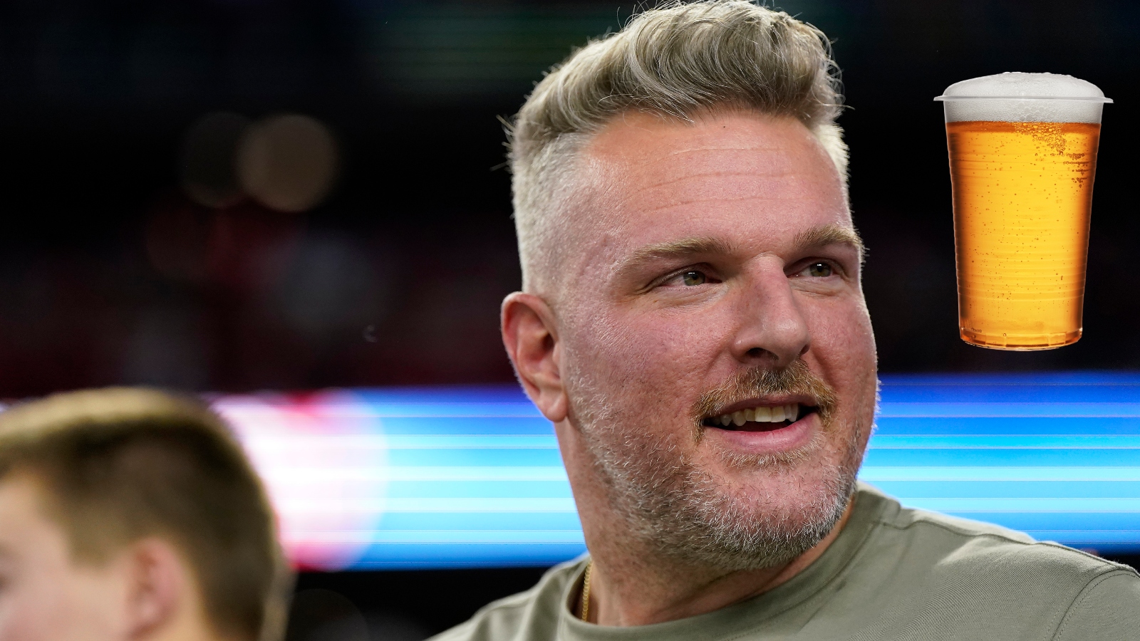 Pat McAfee staring at a beer in a cup