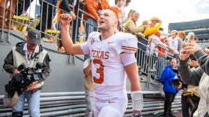 Texas QB Quinn Ewers celebrates after beating Michigan.