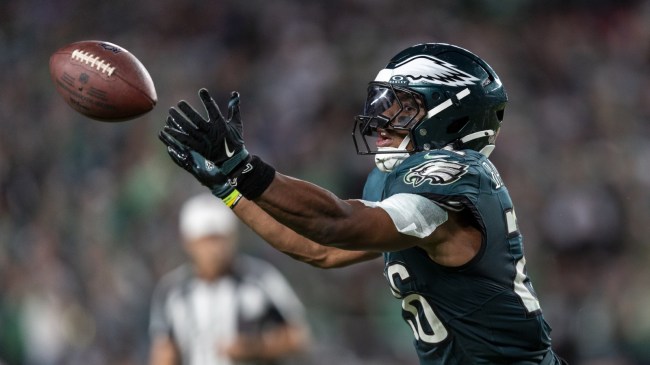 Eagles RB Saquon Barkley reaches for a pass.