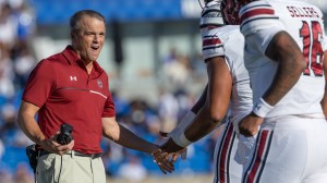 South Carolina Gamecocks coach Shane Beamer high fives players during a game vs. Kentucky.