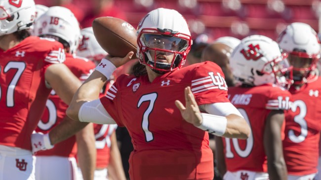 Utah QB Cam Rising warms up before a game.