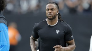 Raiders WR Davante Adams warms up before a game.