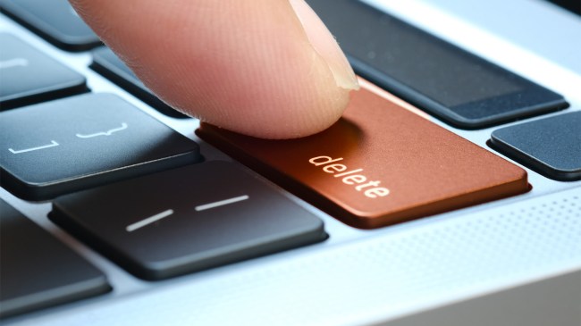 Finger delete button on computer keyboard associated press