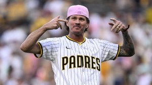 Blink-182 frontman Tom DeLonge throws out the first pitch at a San Diego Padres playoff game.