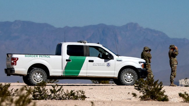 US Border Patrol agents by their truck