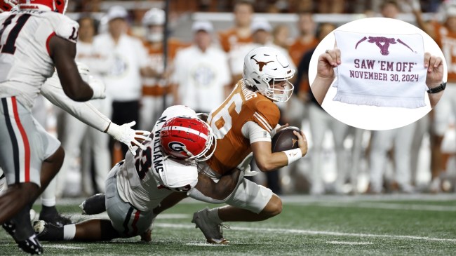 Texas QB Arch Manning is sacked by a Georgia defender.