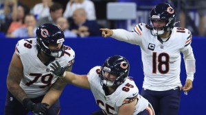 Caleb Williams and Coleman Shelton on the field for the Chicago Bears.